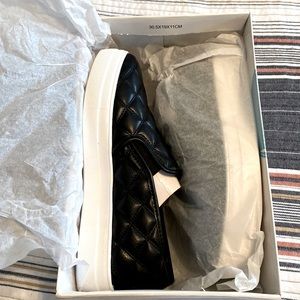 NIB black quilted slip shoes